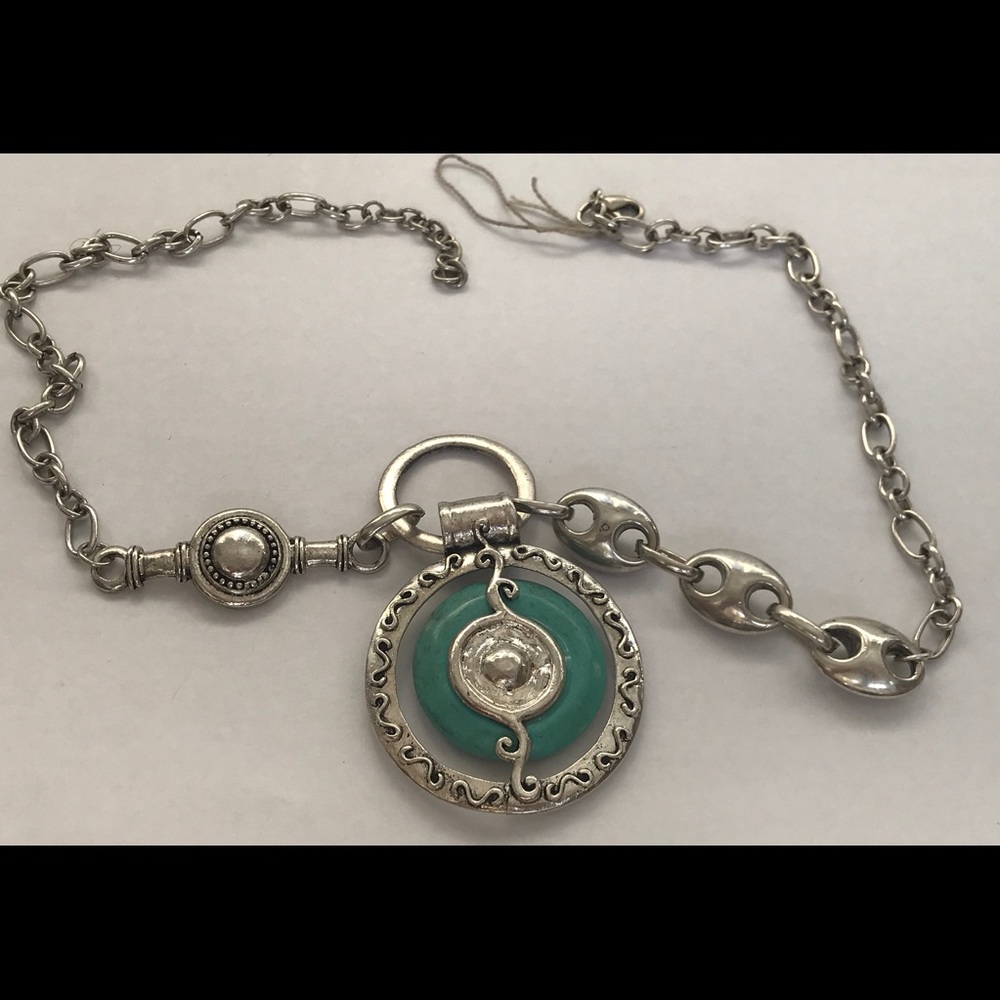 Silver Turquoise pendant with long chain.